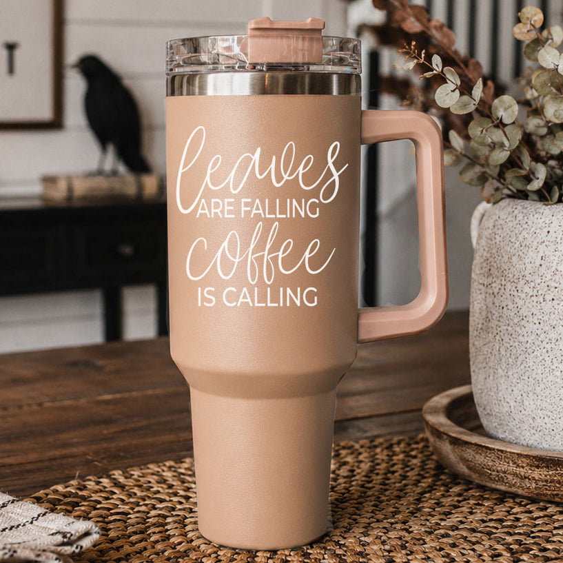 Taupe 40oz travel tumbler with clear lid and straw, rose handle, “Leaves” graphic on front