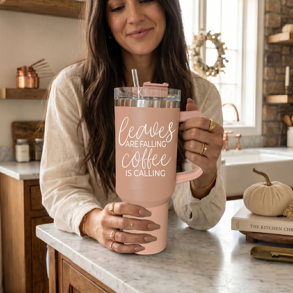 40 oz light rose tumbler with handle, clear lid, and straw; “Coffee is calling”
