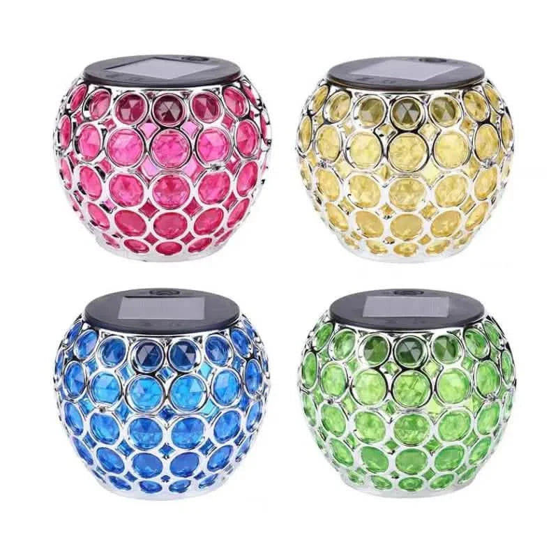 LED solar hollow lawn lamp set showing pink, yellow, blue, and green mosaic globes