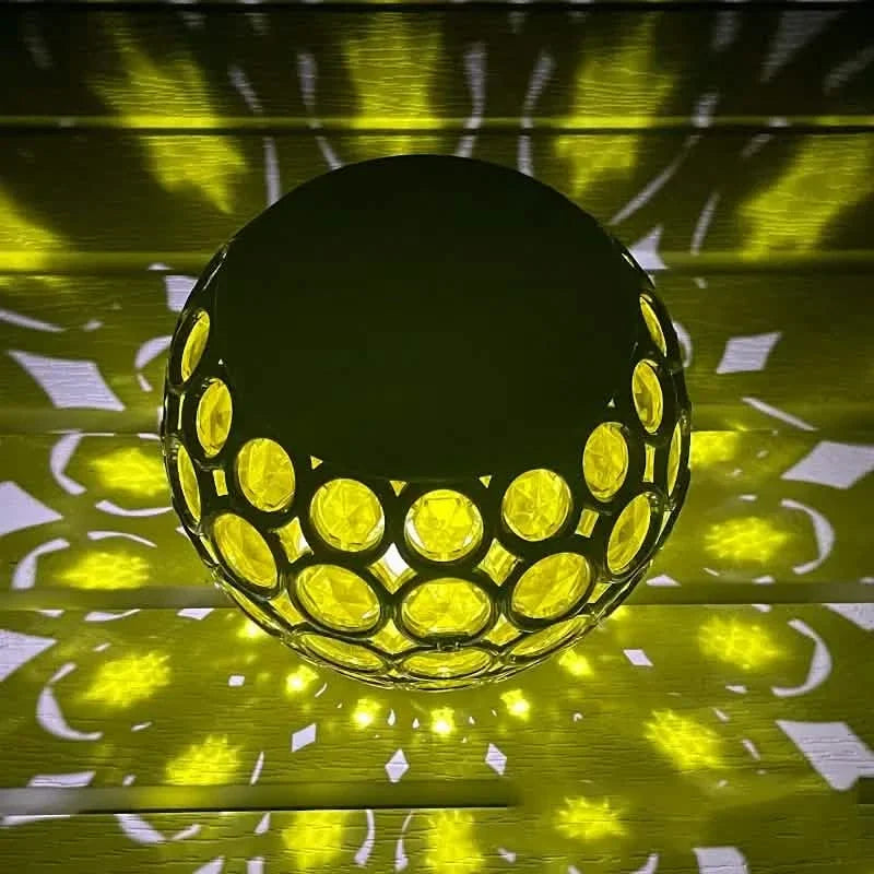 Glowing yellow LED solar hollow lawn lamp with mosaic glass globe