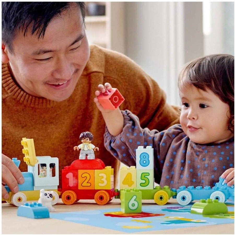 Number train learning toy with colorful numbered blocks and two figures
