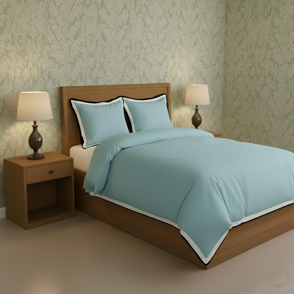 Light blue duvet cover set with white border frame and matching pillowcases