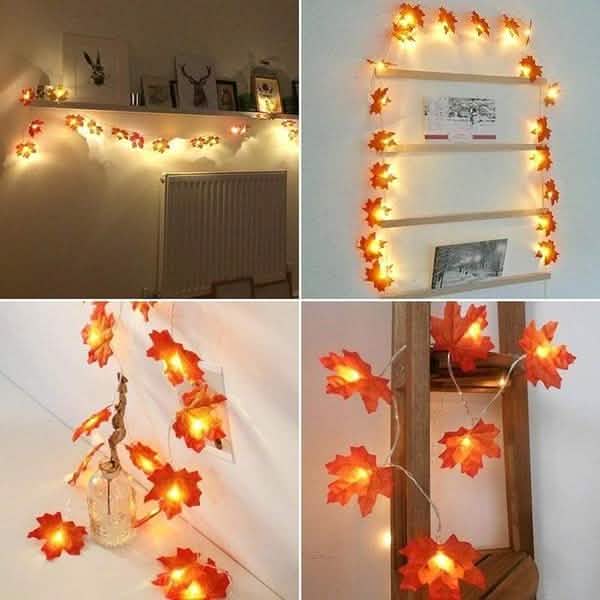 Lighted fall leaf string lights with warm glowing LEDs shown on indoor wall