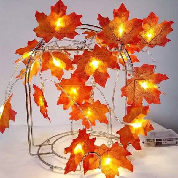 Lighted fall leaf LED string lights with orange-red maple leaves and warm glowing bulbs