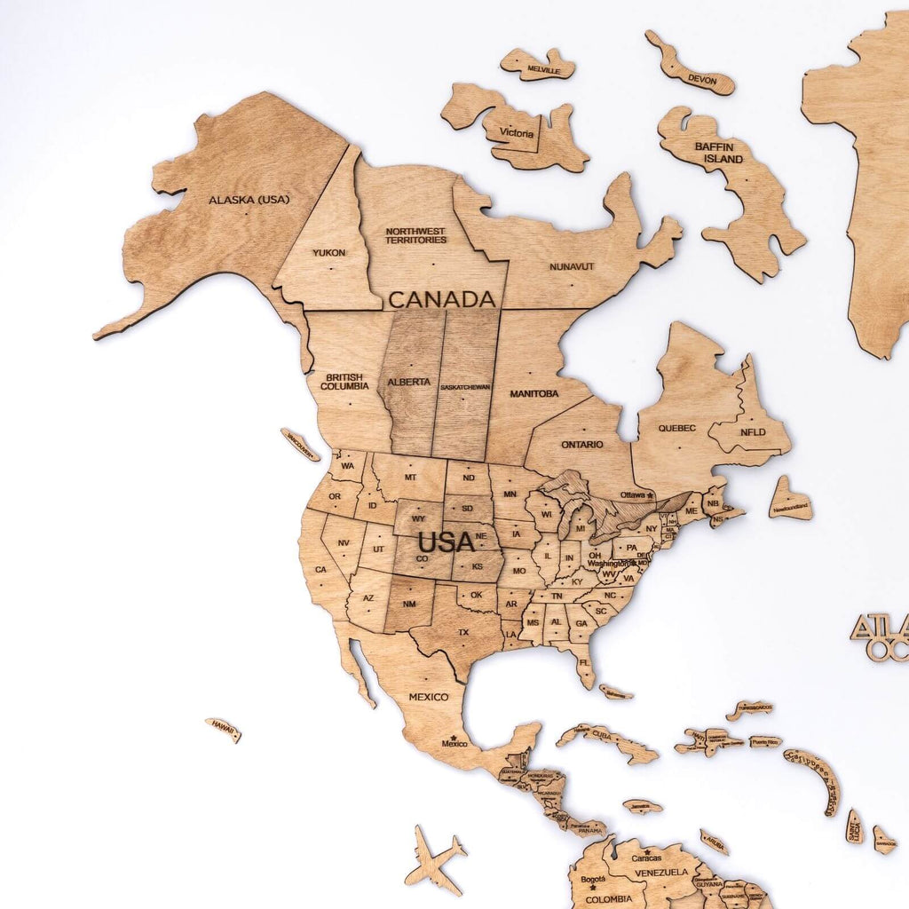 Laser-engraved wooden map of Canada and USA with state names and island pieces