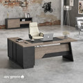 L-shaped office desk with dark pedestal base, wood-look top, and keyboard tray