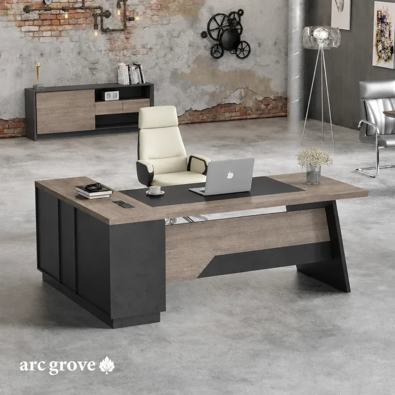 L-shaped office desk with dark pedestal base, wood-look top, and keyboard tray