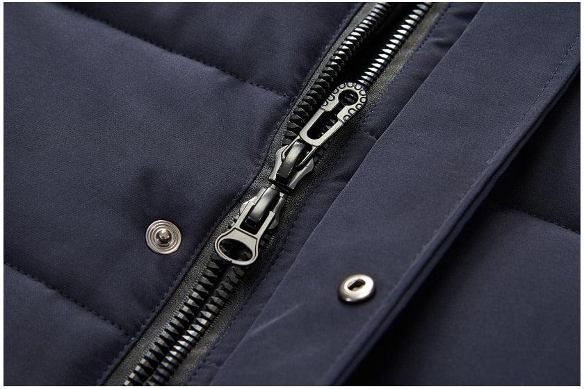 Dark blue jacket zipper details with snap buttons near the hem