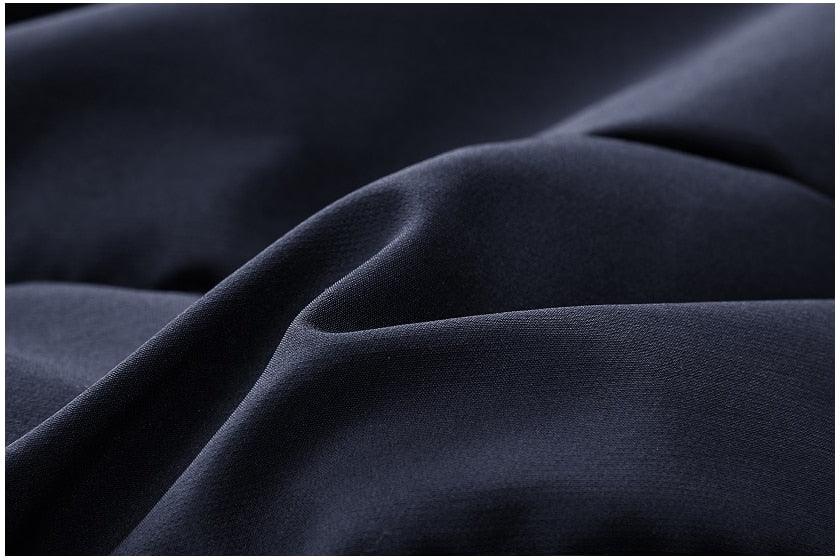 Thick hooded jacket coat fabric, dark navy, textured weave close-up