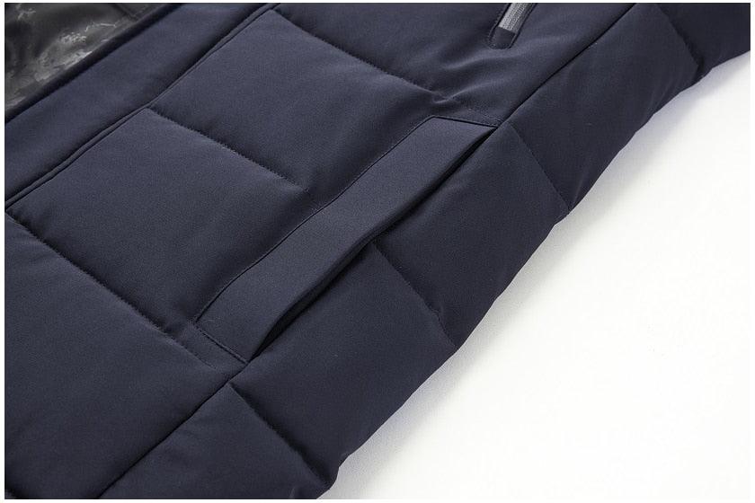 Dark blue quilted puffer jacket with stitched padding panels