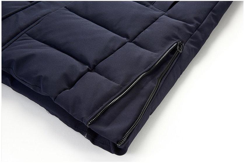 Dark blue long puffer jacket hem with side zipper