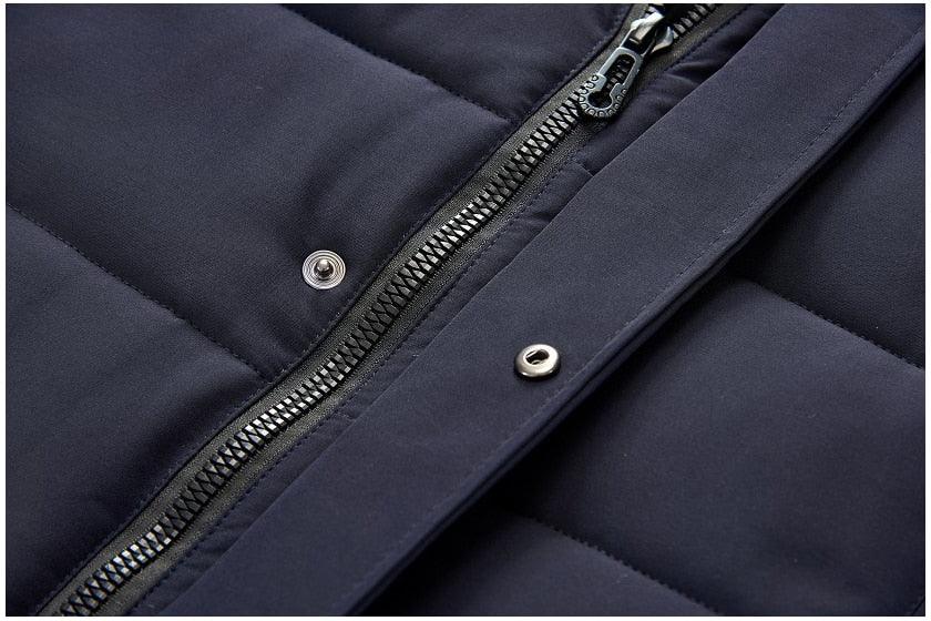Dark blue hooded jacket front placket with zipper and snap buttons