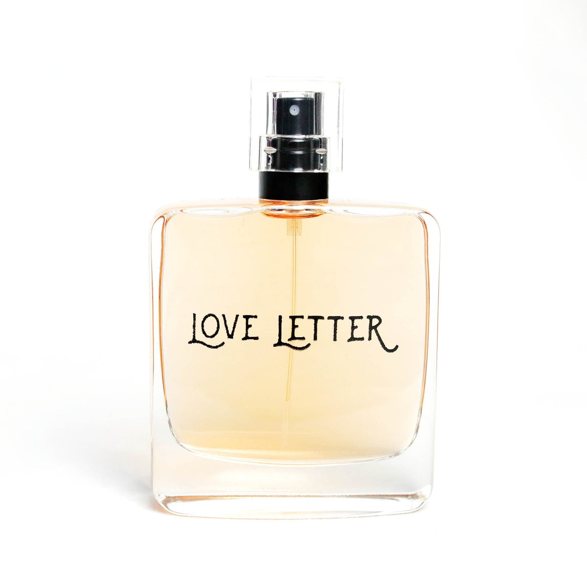 Botanical perfume glass bottle with black sprayer and amber liquid