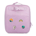 Lilac kids lunch box with stitched patches, zipper closure, and top carry handle