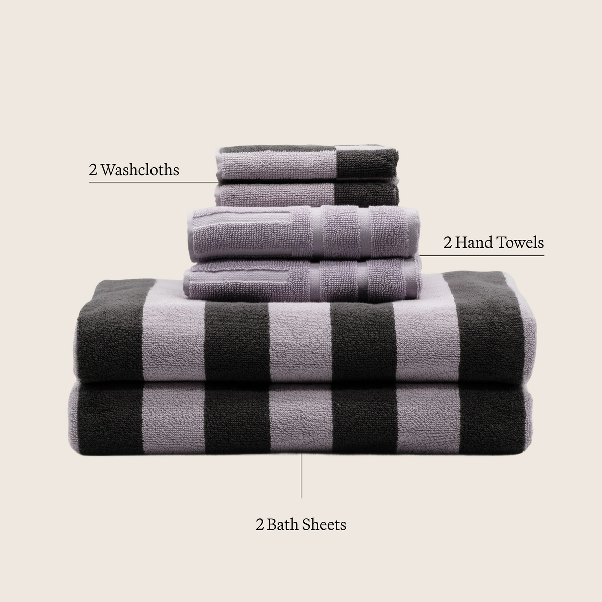 Lilac and dark striped cotton towel stack with folded washcloth and hand towel layers