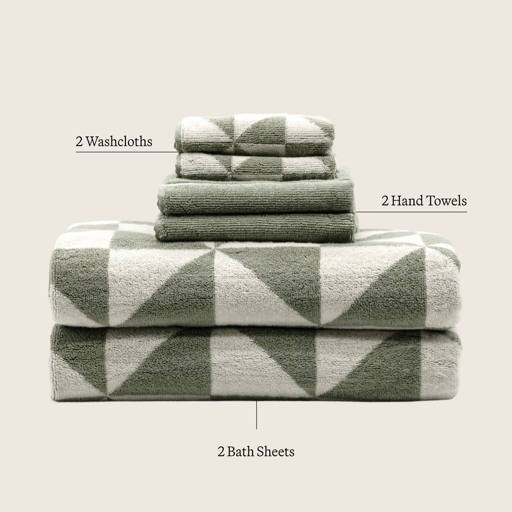 Sage green and ecru patterned towel set, stacked bath sheets and washcloths