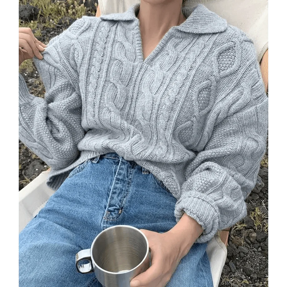 Gray-blue cable knit sweater with turn-down collar, worn with blue jeans