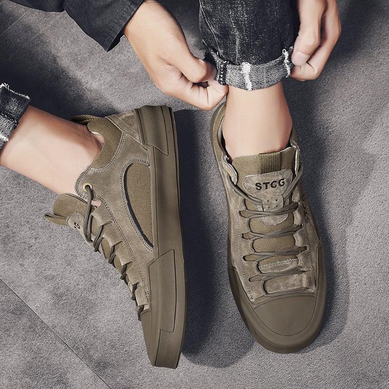 Men's tan lace-up sneakers, close-up with STCG logo on tongue