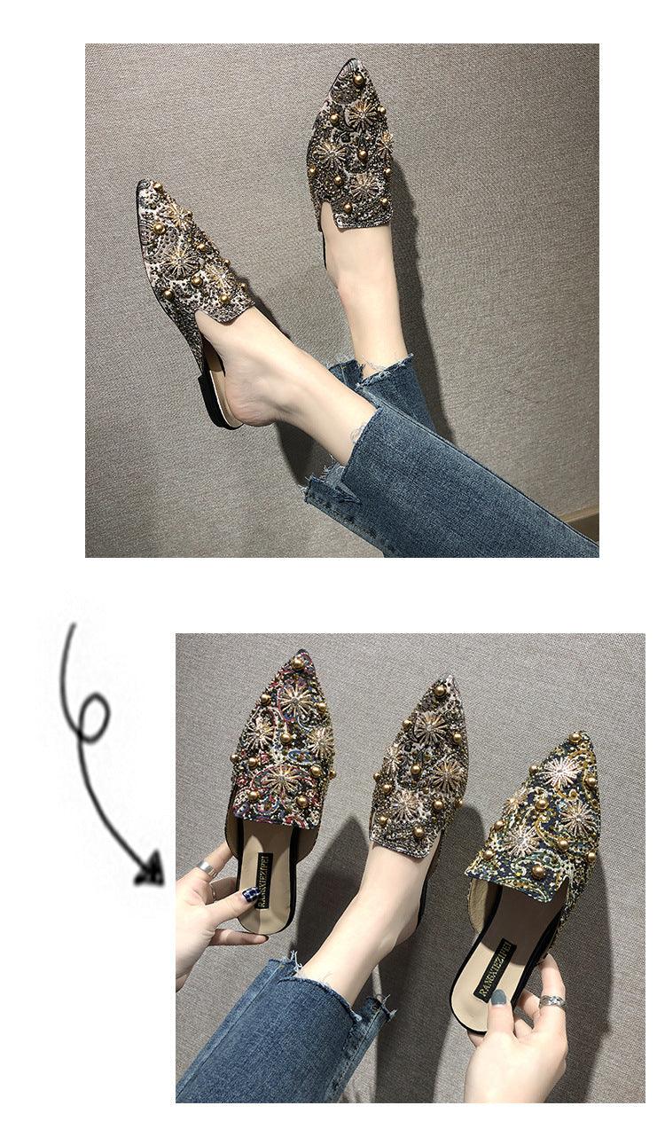 Gold-and-gem pointed-toe mules with low heel; decorative stud pattern across top.
