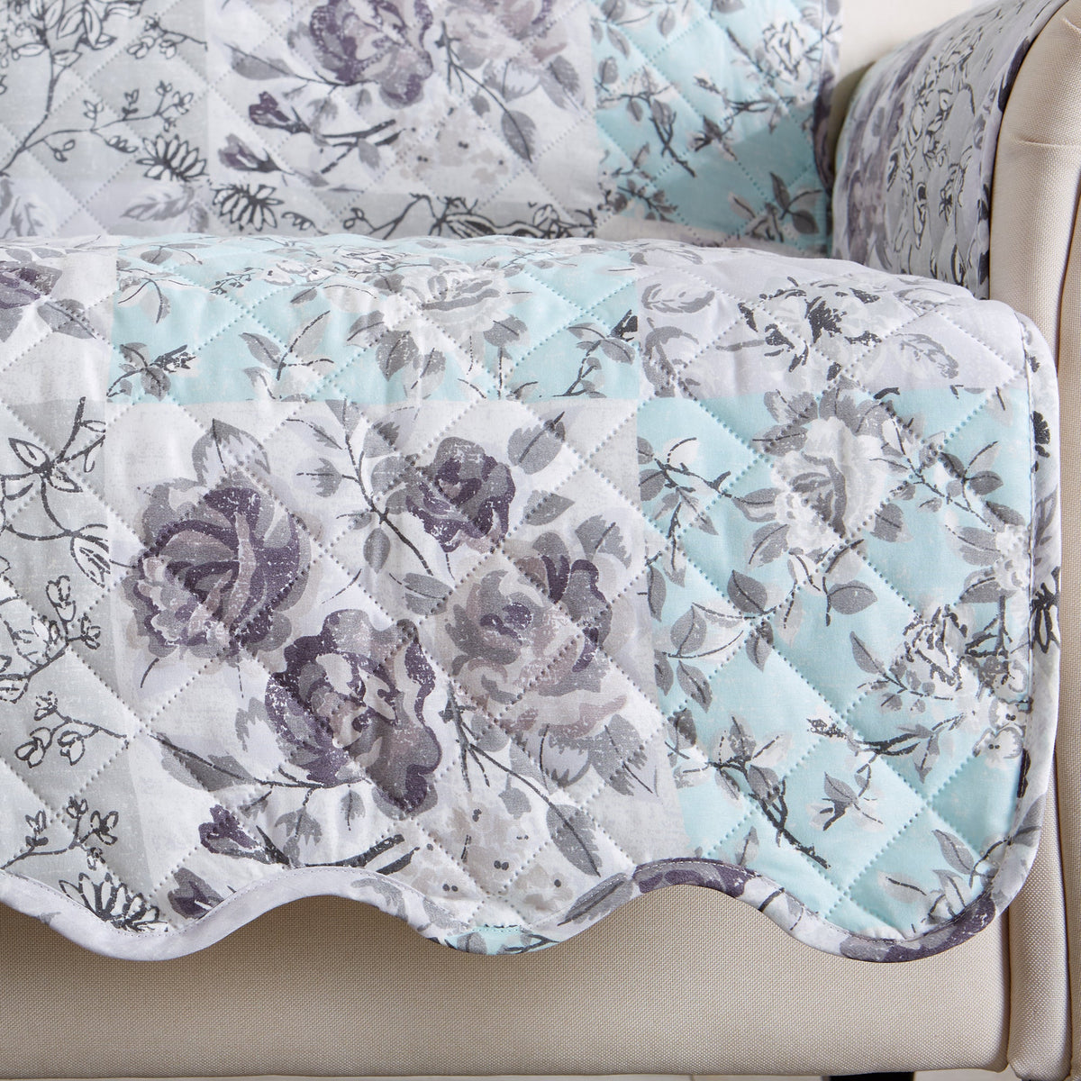 Reversible floral patchwork furniture protector close-up, white floral print with light blue border