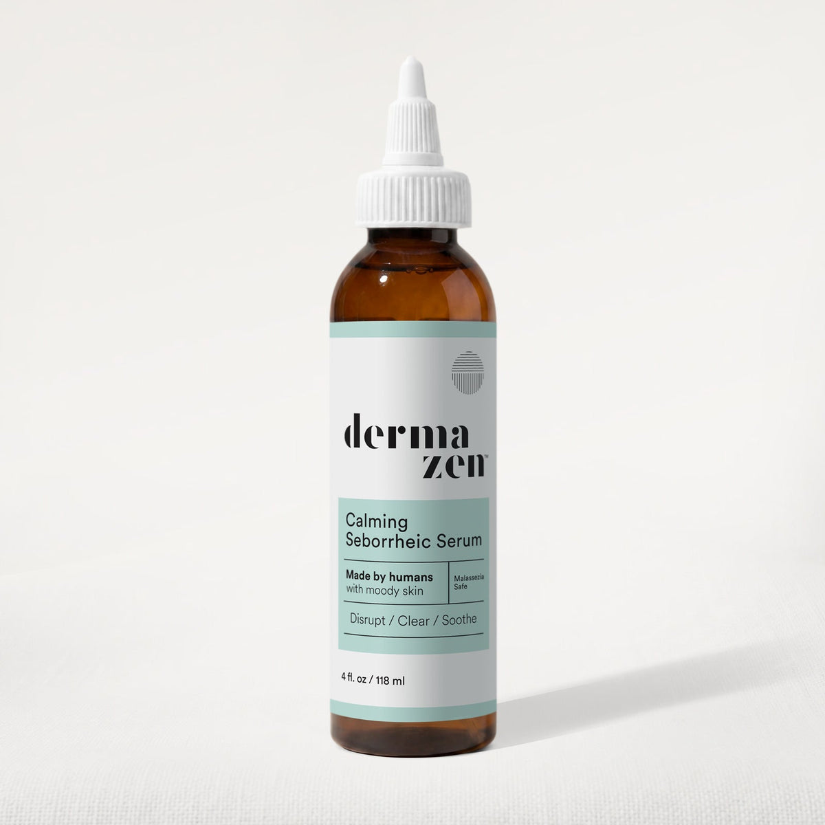 Amber scalp serum bottle with dropper, white label reading Calming Seborrheic Serum