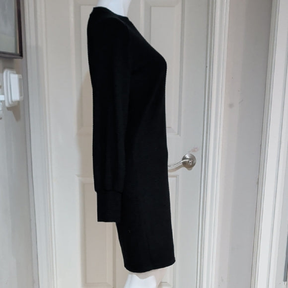 Black ribbed long-sleeve bodycon dress, side view