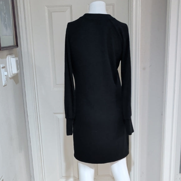 Black ribbed long-sleeve bodycon dress, back view