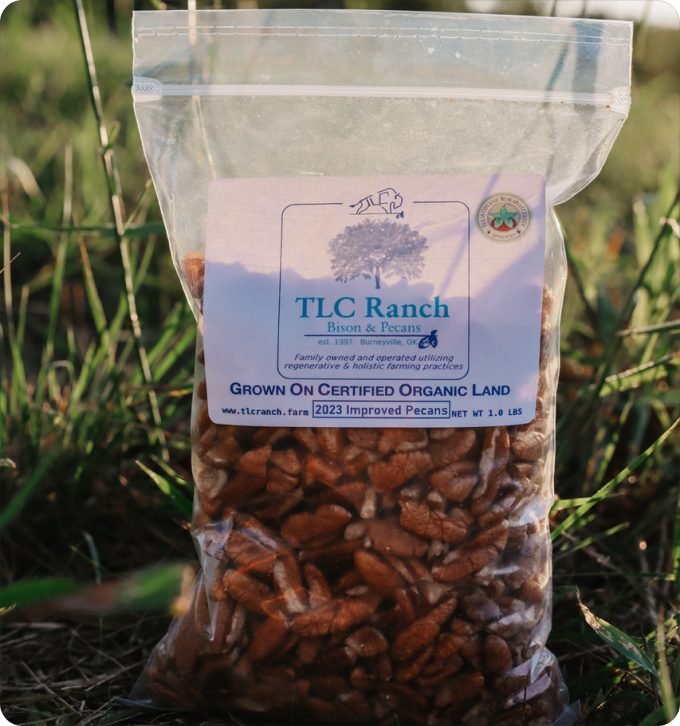 Organic pecan pieces in 1 lb clear pouch, brown nuts visible