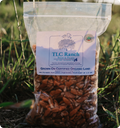 Organic pecan pieces in 1 lb clear pouch, brown nuts visible