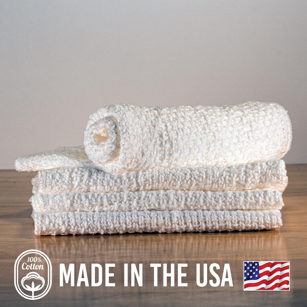 Stacked white cotton dishcloths, textured weave, made for 11" x 11"