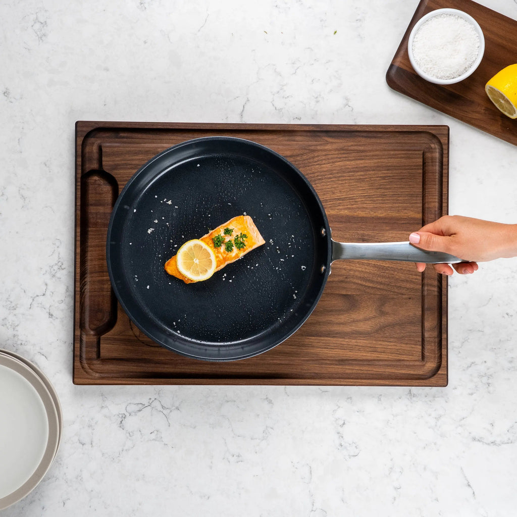 Ceramic nonstick frying pan, black skillet with handle and lemon slice cooking