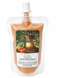 Squeezable wax melt pouch, Mahogany Pumpkin selected scent, amber-orange wax with pump cap
