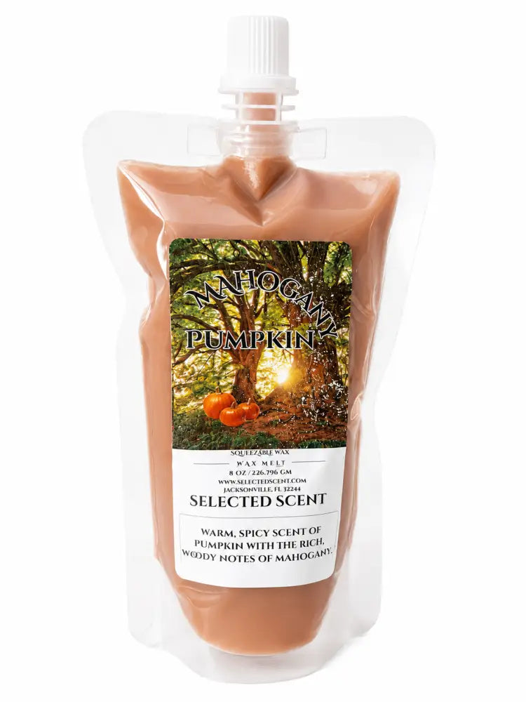 Squeezable wax melt pouch with Mahogany Pumpkin label, peach-orange wax, dispensing nozzle