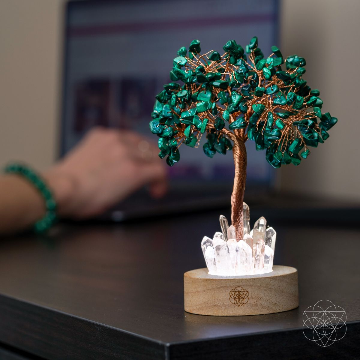 Malachite crystal tree lamp on table with teal branches, copper trunk, and glowing crystal base.