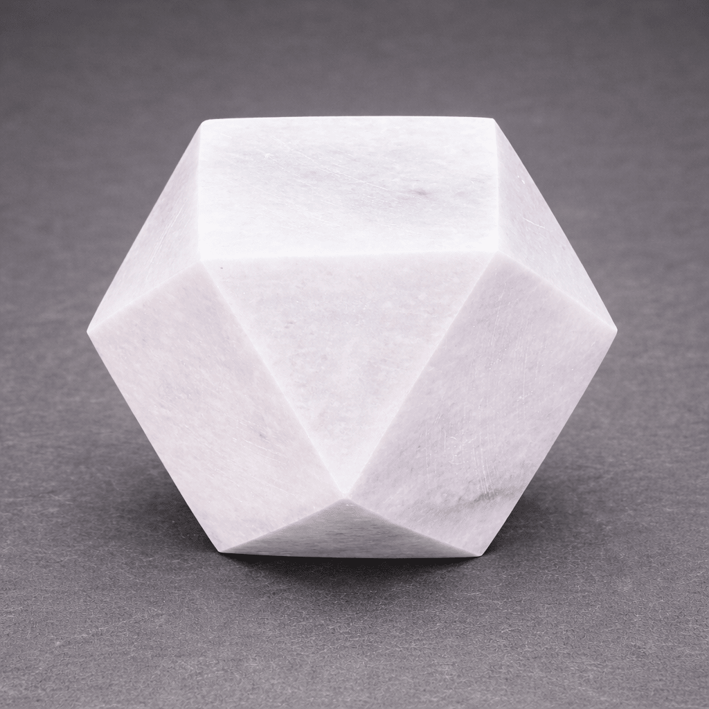 White faceted gemstone desk paperweight with angular polygon faces