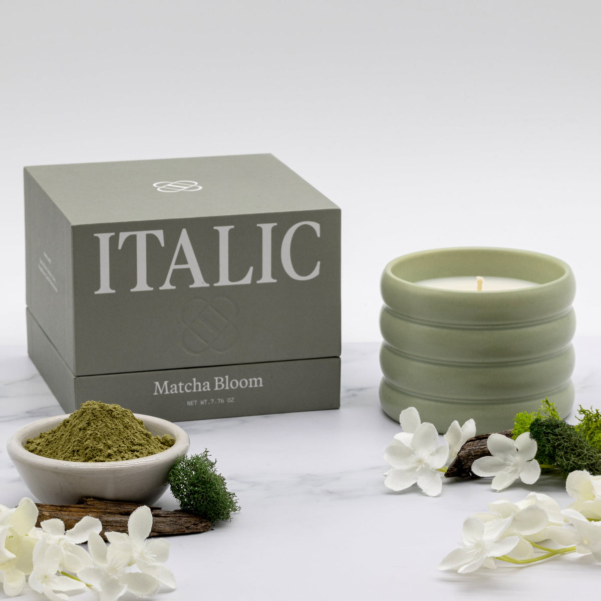 Soy wax ceramic candle in ribbed mint-green ceramic jar with flame; Matcha Bloom box.