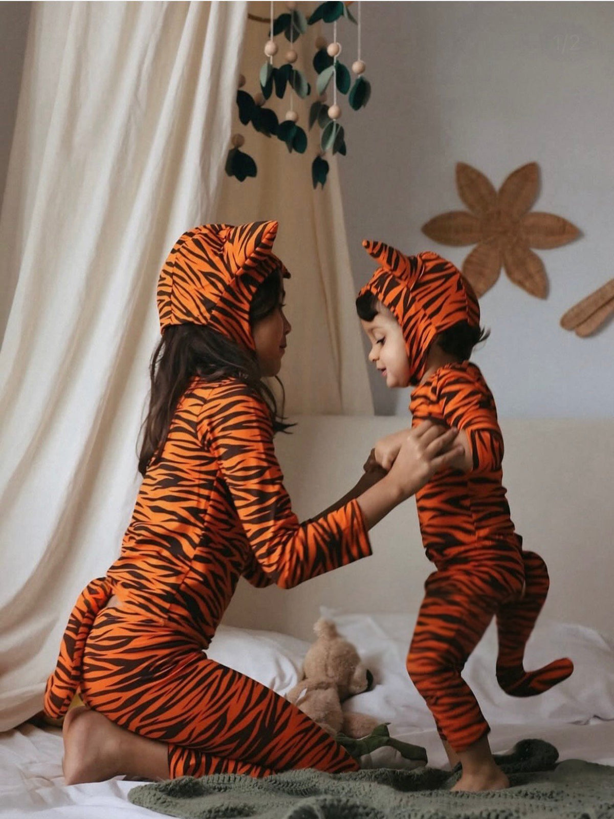 Orange-and-black tiger-print hooded bodysuit with matching tail, kids’ costume