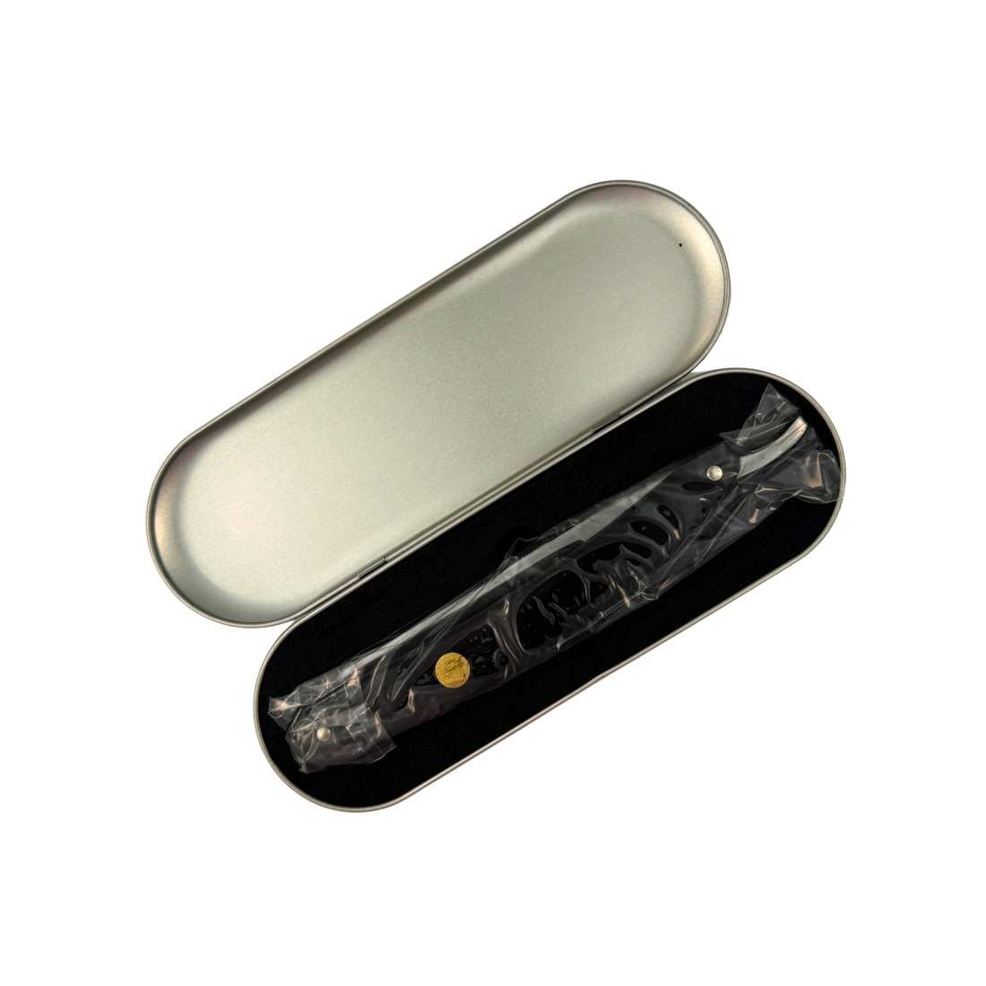 Straight razor case with open silver lid and black interior