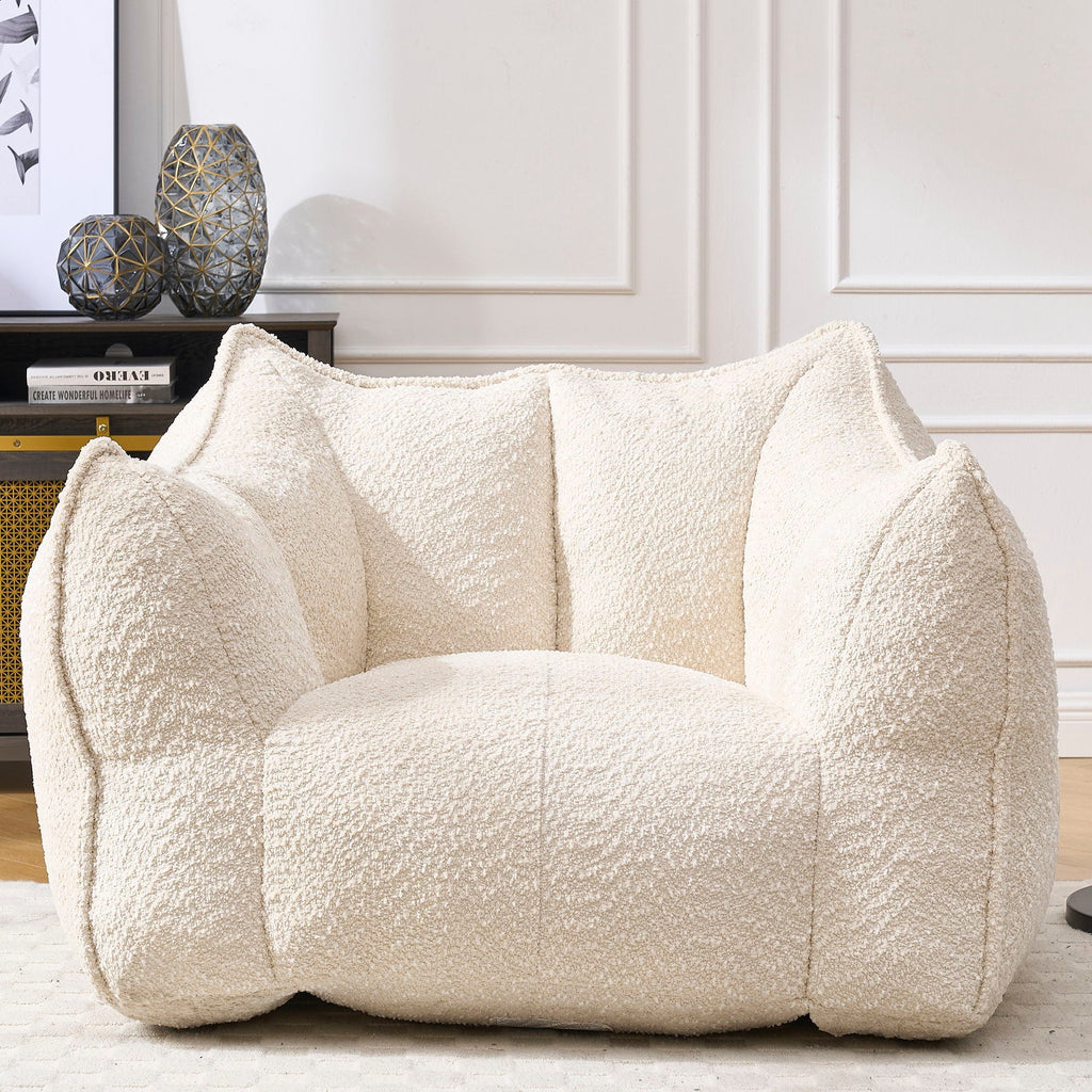 Cream chenille arm chair with rounded padded arms and supportive back