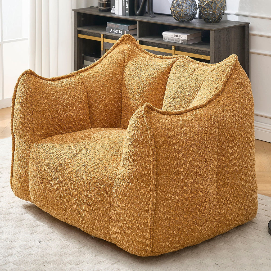 Amber chenille arm chair with curved arms and thick, cushioned seat