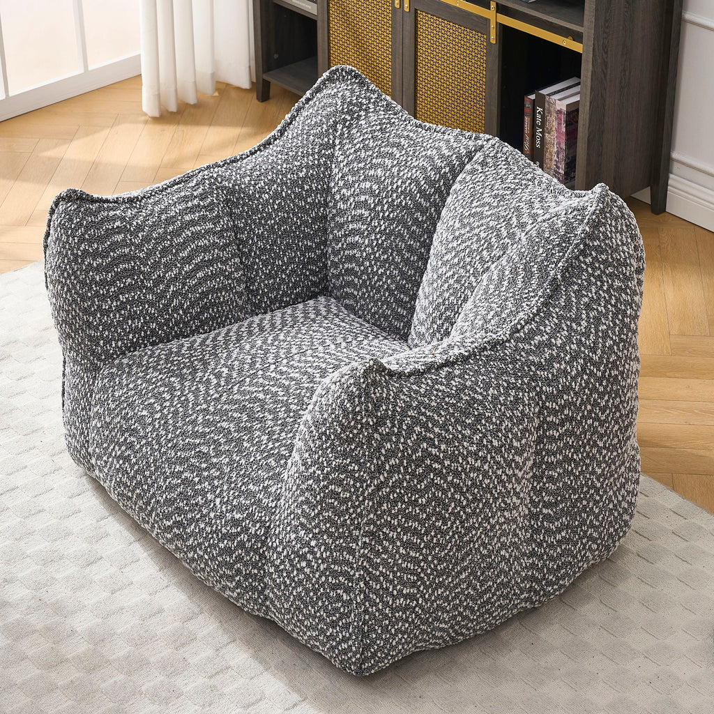 Dark gray chenille arm chair with rounded arms and deep padded seat