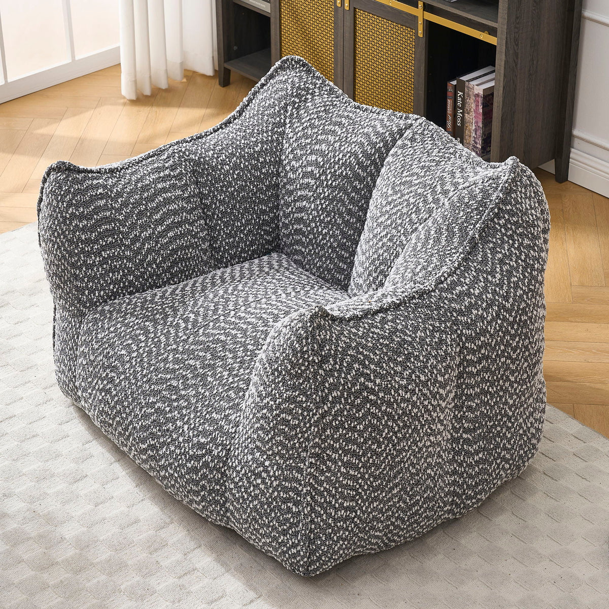 Dark gray chenille arm chair with rounded arms and deep padded seat