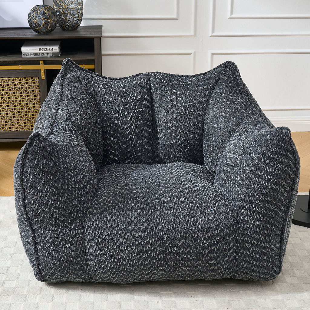 Chenille arm chair in dark gray chenille with tall rounded arms and cushioned seat