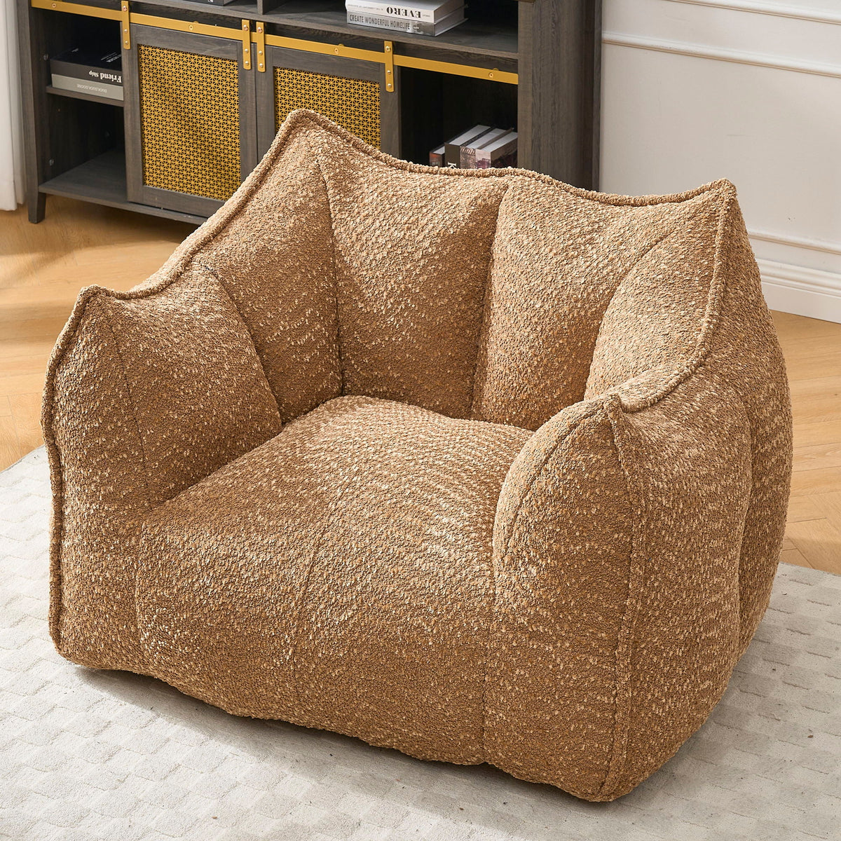 Light brown chenille arm chair with cushioned back and curved armrests