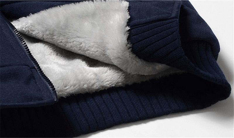Navy hoodie sleeve with ribbed cuffs and plush light inner lining