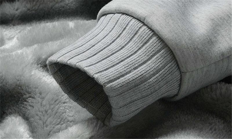 Gray sweatshirt sleeve with ribbed knit cuff and plush inner lining
