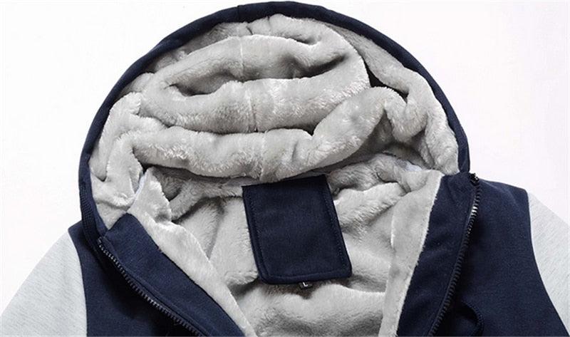 Navy zip-up hoodie with hood, plush light lining and rectangular chest tab