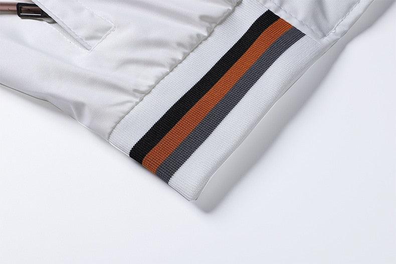Men’s white jacket cuff detail with black and orange striped ribbed band