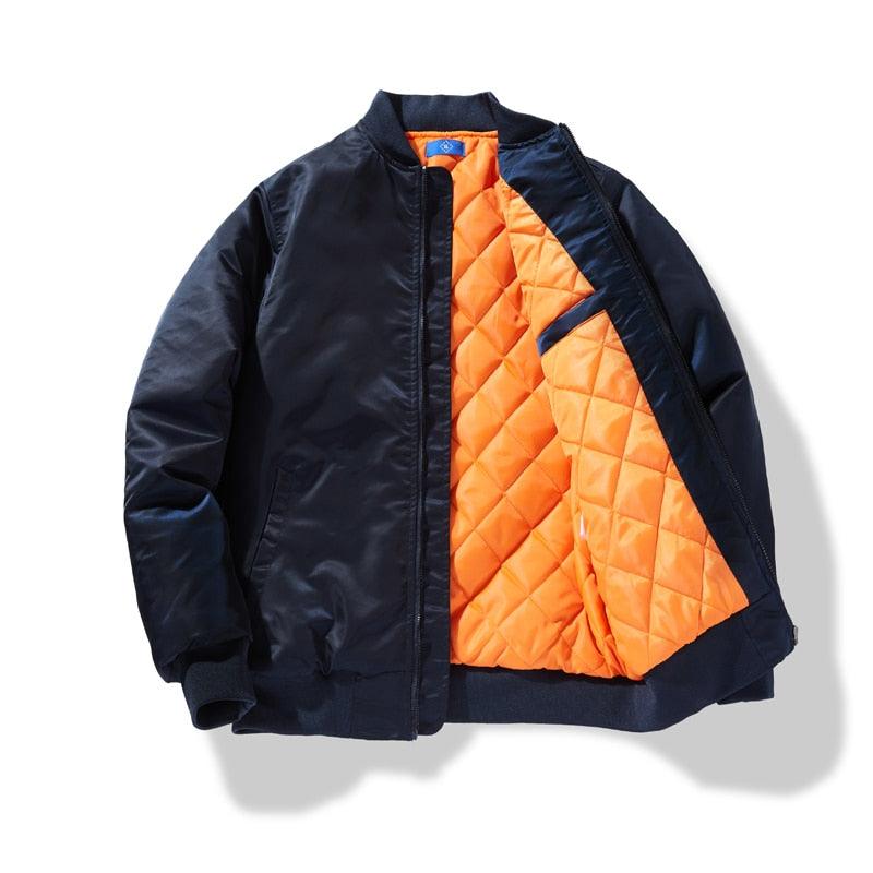 Navy padded jacket with orange quilted lining and zip front, stand collar