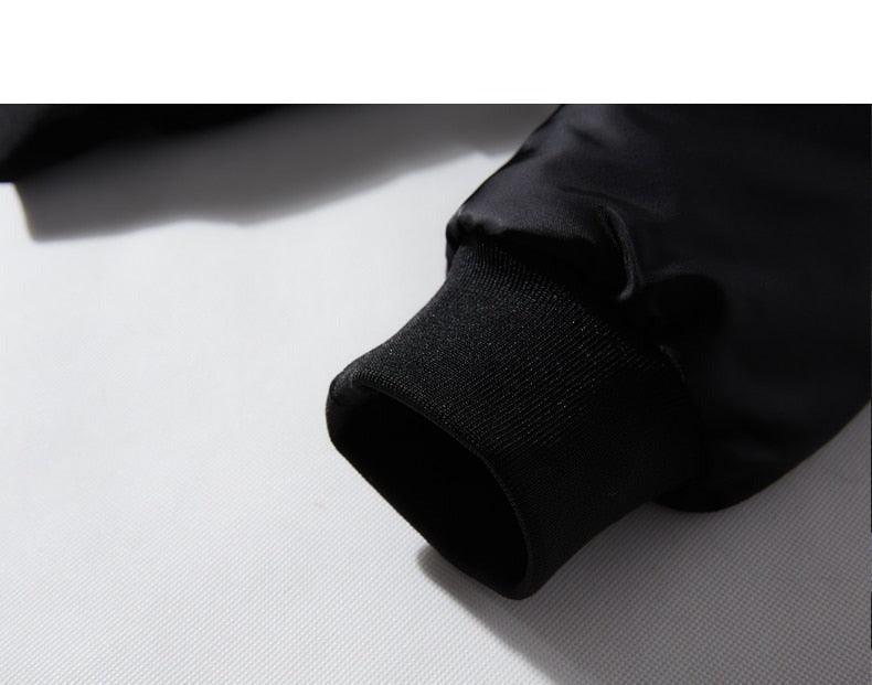 Black jacket cuff and hem with ribbed knit trim